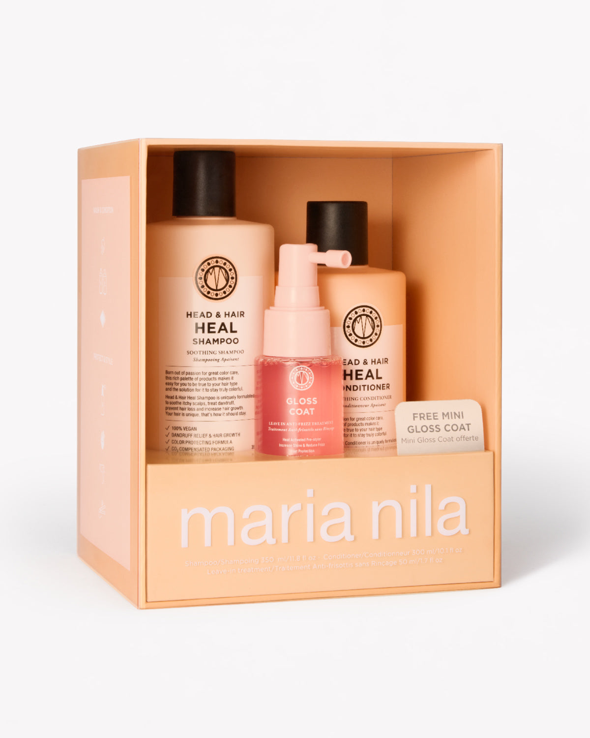 Maria Nila Head & Hair Heal gift set in a peach-colored box, containing a shampoo bottle, a conditioner bottle, and a mini gloss coat.