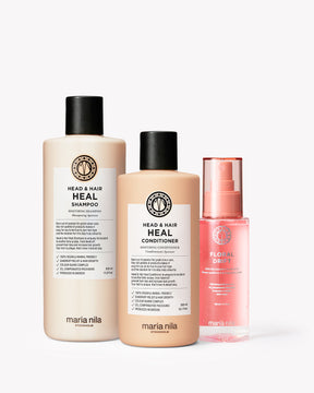Three Maria Nila hair care products on a white background